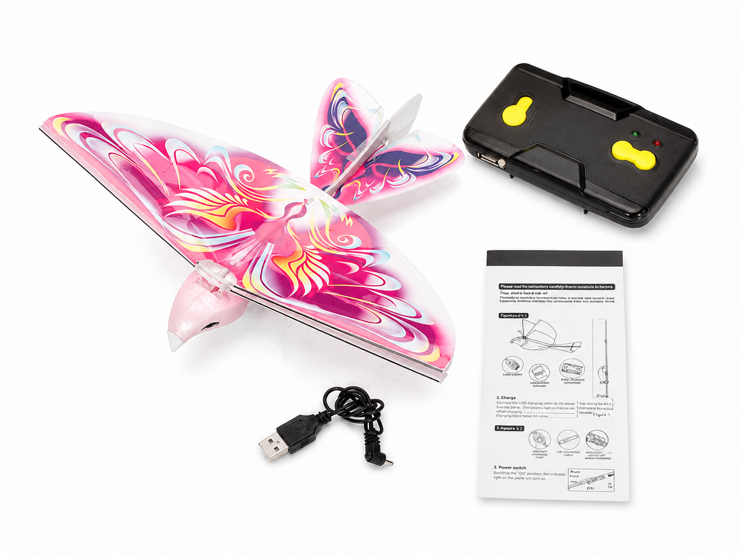 Lieferumfang des E-BIRD Flugvogels mit Fernsteuerung, USB-Ladekabel und Bedienungsanleitung
